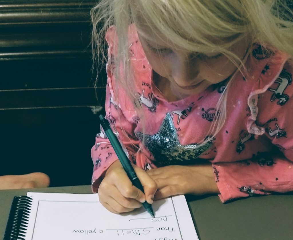 Girl doing French Dictation in our Charlotte Mason Homeschool